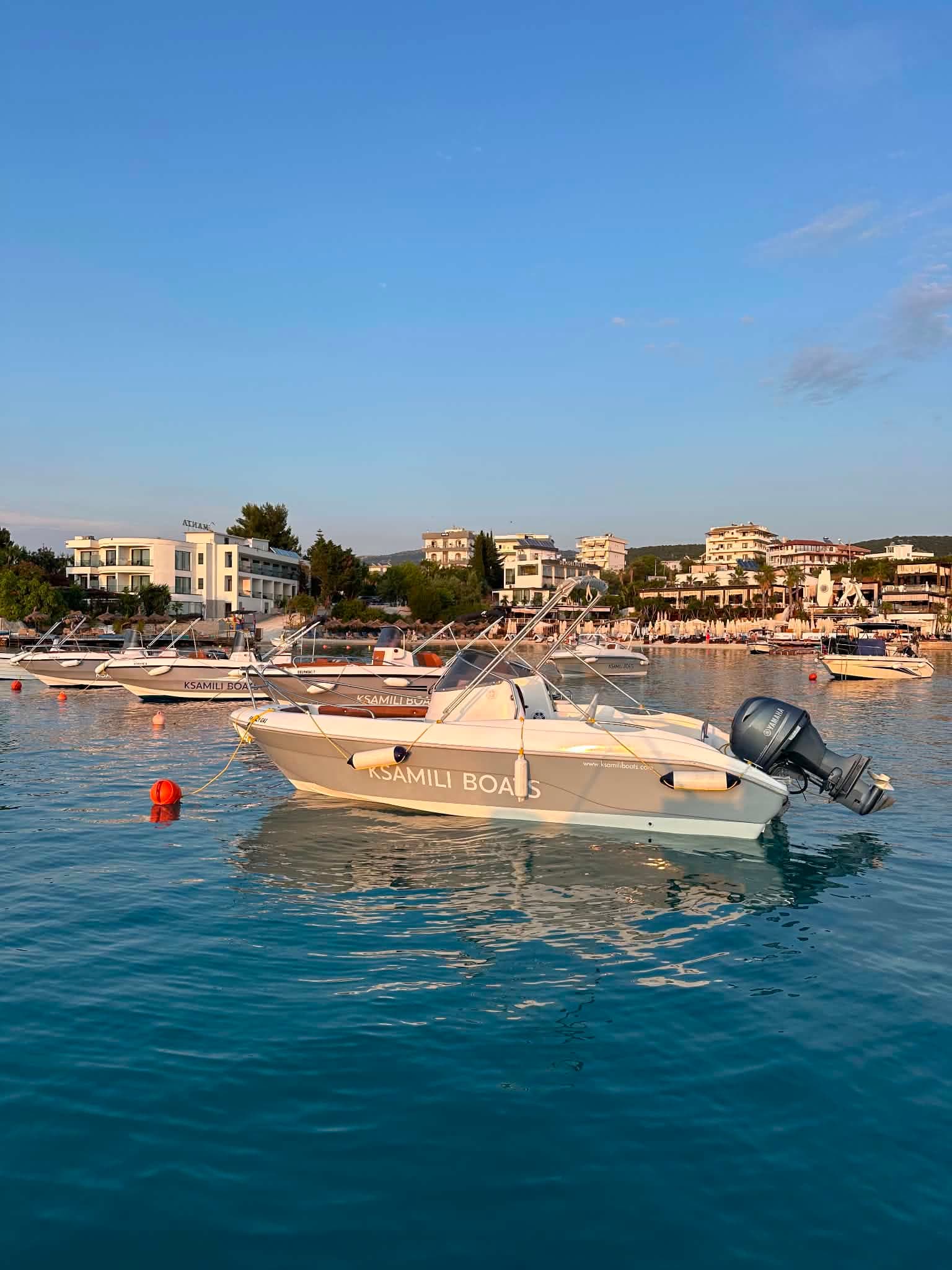 Ksamili Boats hull at golden hour on the home mooring in Ksamil harbour